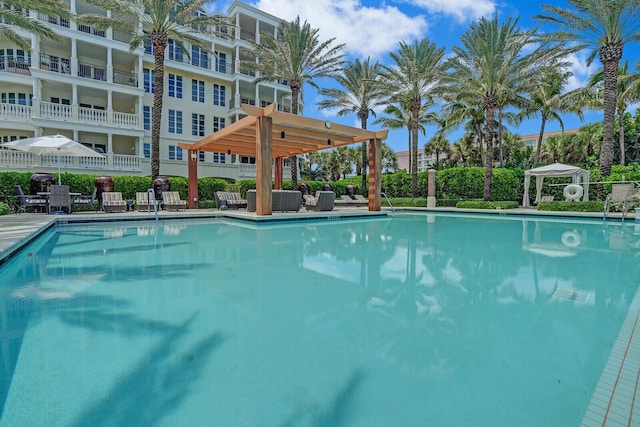 view of swimming pool with a pergola