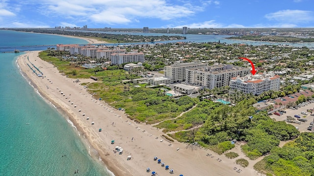 bird's eye view featuring a water view and a view of the beach