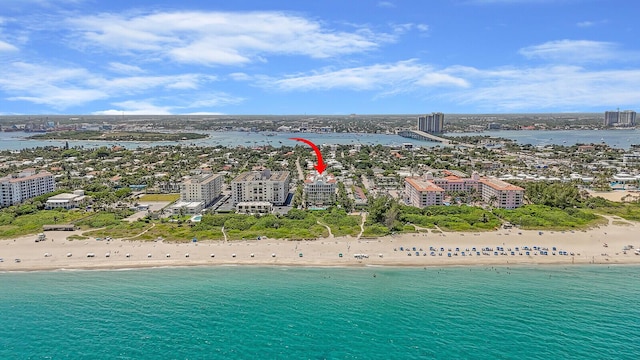 aerial view featuring a view of the beach and a water view