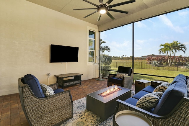 sunroom / solarium with a ceiling fan