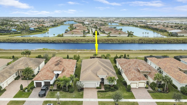 aerial view featuring a residential view and a water view