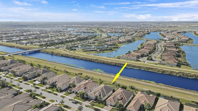 aerial view with a residential view and a water view