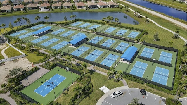 birds eye view of property featuring a water view and a residential view