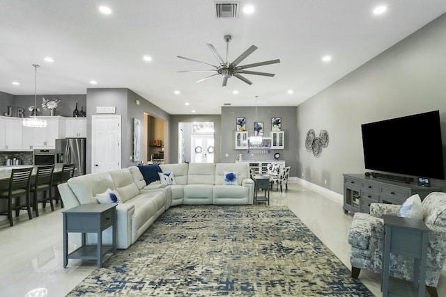 living area featuring recessed lighting, visible vents, baseboards, and a ceiling fan