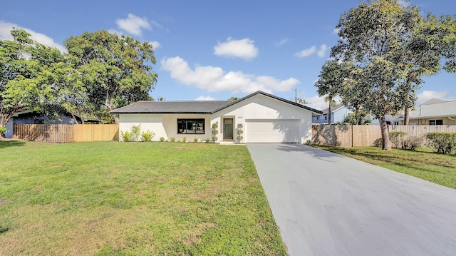 single story home featuring a front lawn and a garage