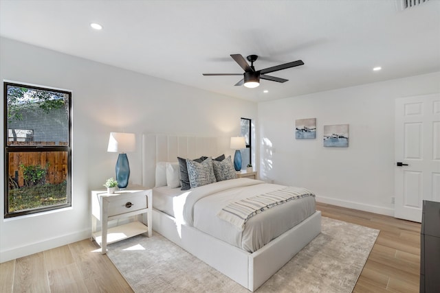 bedroom featuring light hardwood / wood-style floors and ceiling fan