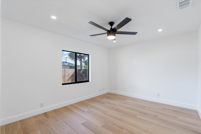 unfurnished room with ceiling fan and light hardwood / wood-style flooring