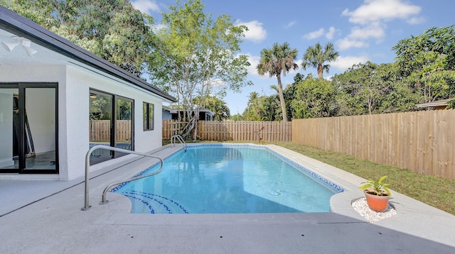 view of pool featuring a patio