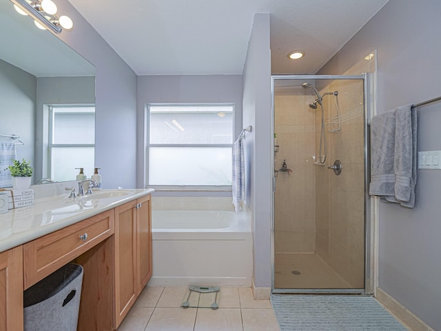 bathroom featuring vanity, separate shower and tub, and tile patterned floors