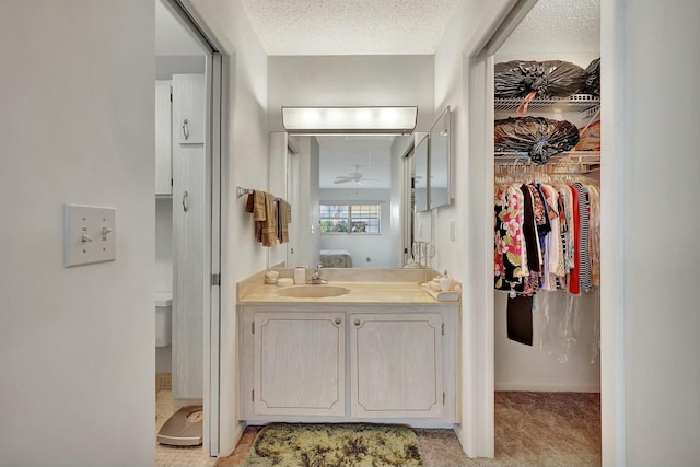 bathroom featuring vanity and a textured ceiling