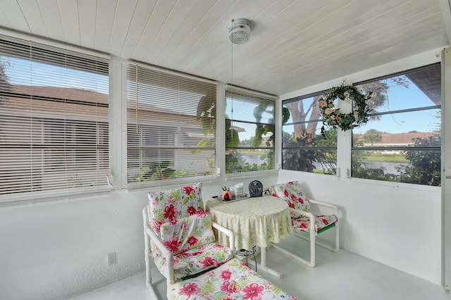 sunroom featuring wood ceiling