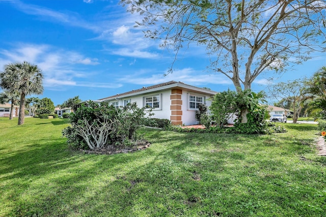 view of home's exterior featuring a lawn