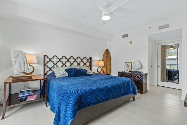 bedroom with hardwood / wood-style flooring and ceiling fan