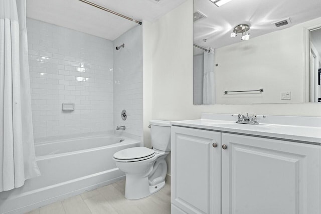 full bathroom featuring vanity, shower / tub combo, tile patterned floors, and toilet