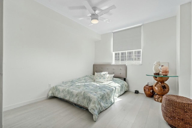 bedroom featuring hardwood / wood-style flooring and ceiling fan