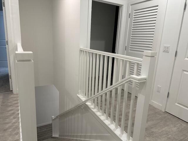 stairs featuring hardwood / wood-style flooring