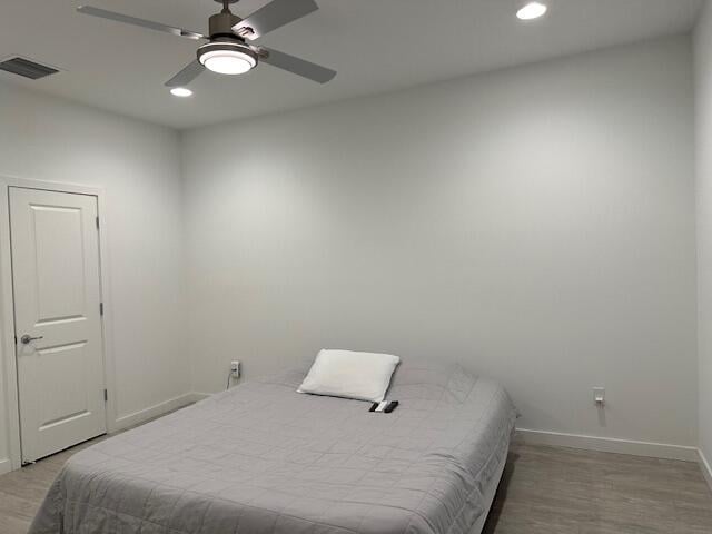 bedroom featuring ceiling fan and light wood-type flooring