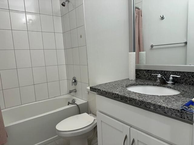 full bathroom with vanity, toilet, and shower / bath combo with shower curtain