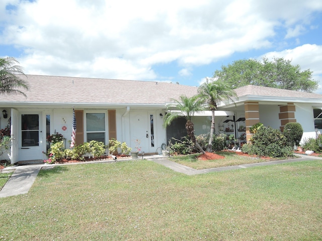 ranch-style home with a front yard