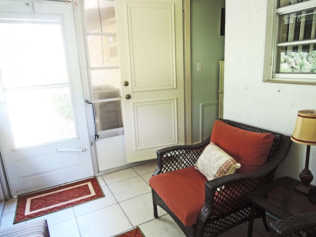 doorway featuring a wealth of natural light and light tile patterned floors