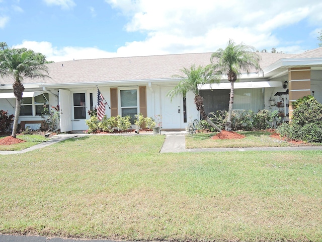 ranch-style house with a front yard