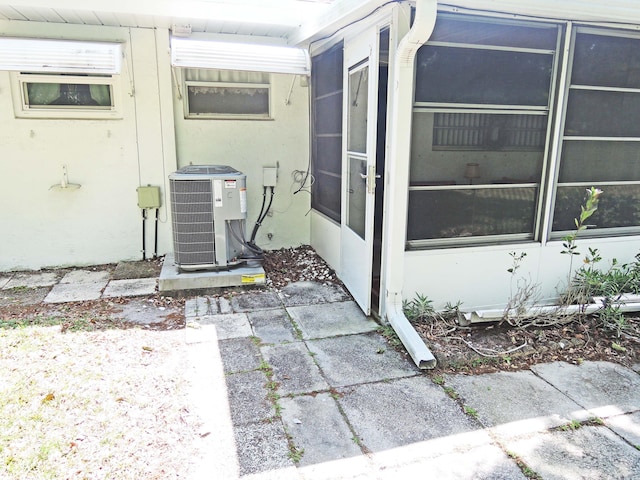 entrance to property featuring cooling unit