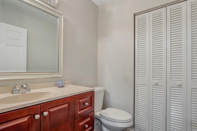 bathroom with toilet and vanity