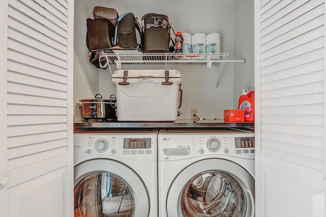 laundry area with independent washer and dryer