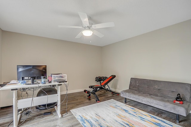 office area with hardwood / wood-style floors and ceiling fan