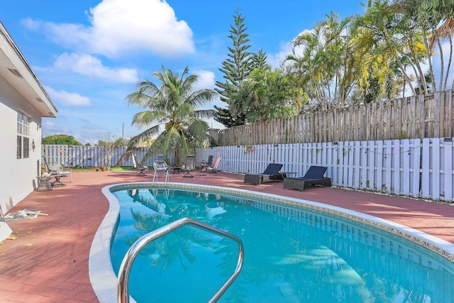 view of pool featuring a patio area