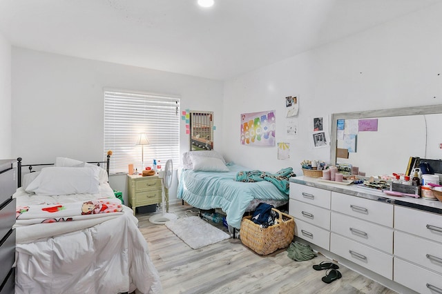 bedroom with light hardwood / wood-style flooring