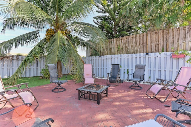 view of patio featuring an outdoor fire pit