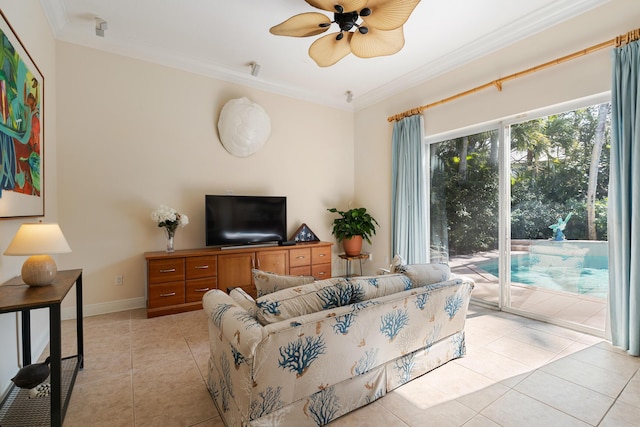 tiled living room with ceiling fan and ornamental molding