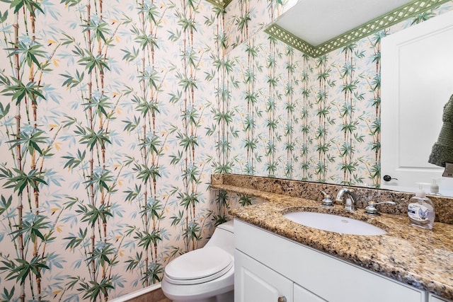 bathroom with vanity and toilet