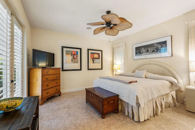 tiled bedroom with ceiling fan