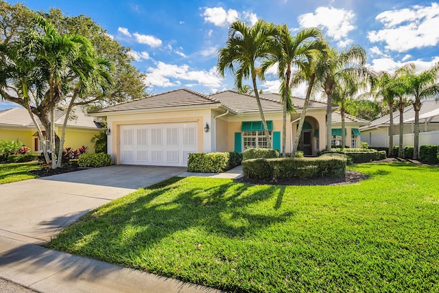 view of front facade featuring a garage and a front yard