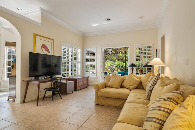 tiled living room with crown molding and a healthy amount of sunlight