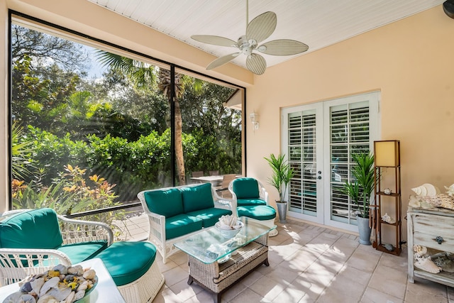 sunroom featuring french doors and ceiling fan