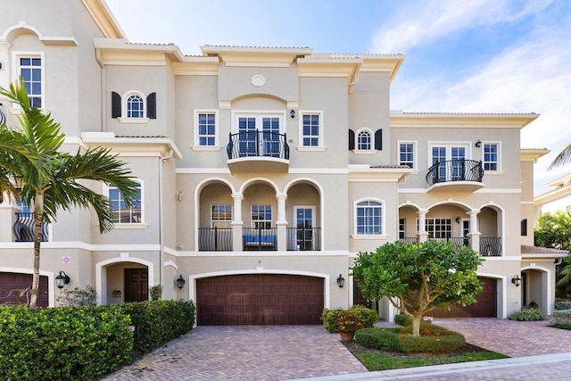 mediterranean / spanish-style home featuring a garage