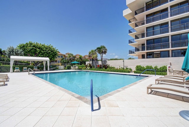 view of swimming pool featuring a patio area