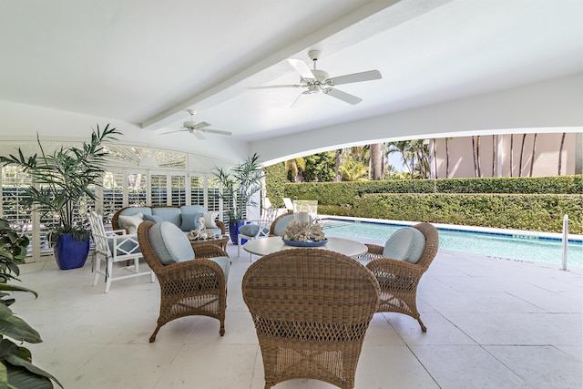 view of patio / terrace featuring ceiling fan and a fenced in pool