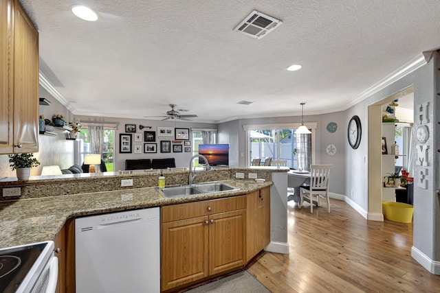 kitchen featuring ornamental molding, sink, white appliances, and light wood-type flooring