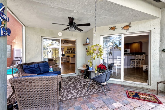 view of patio / terrace featuring ceiling fan