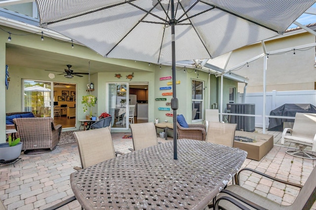 view of patio / terrace featuring central AC unit, ceiling fan, and a grill