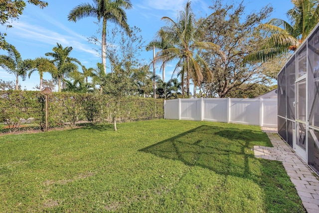 view of yard with a lanai