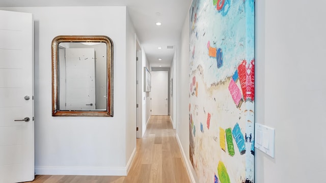 hall with light hardwood / wood-style floors