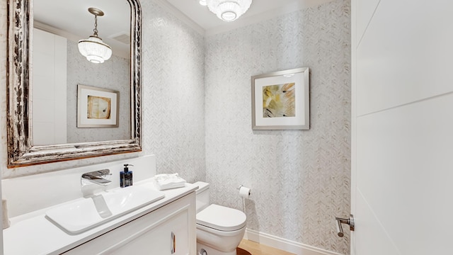 bathroom with vanity and toilet