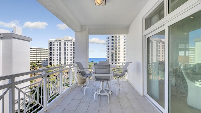 balcony featuring a water view