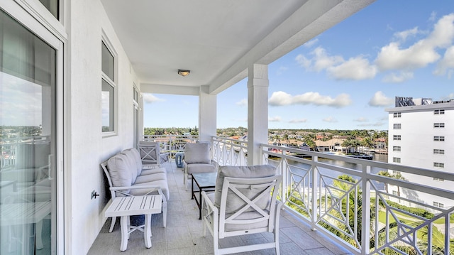 balcony featuring a water view