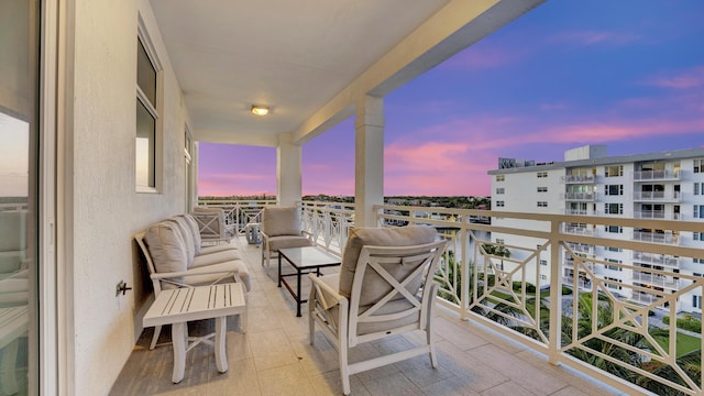 view of balcony at dusk